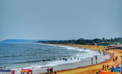 Goa tour package beach view with golden sand and clear water