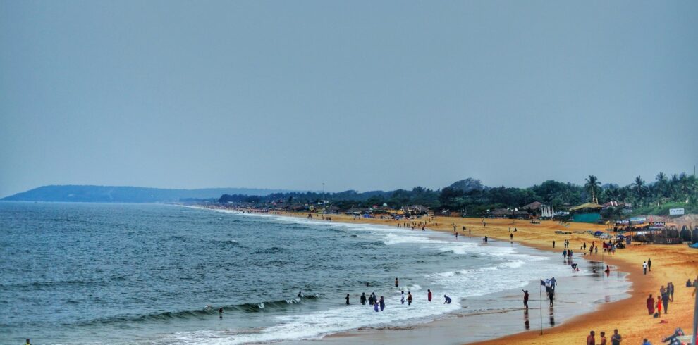 Goa tour package beach view with golden sand and clear water