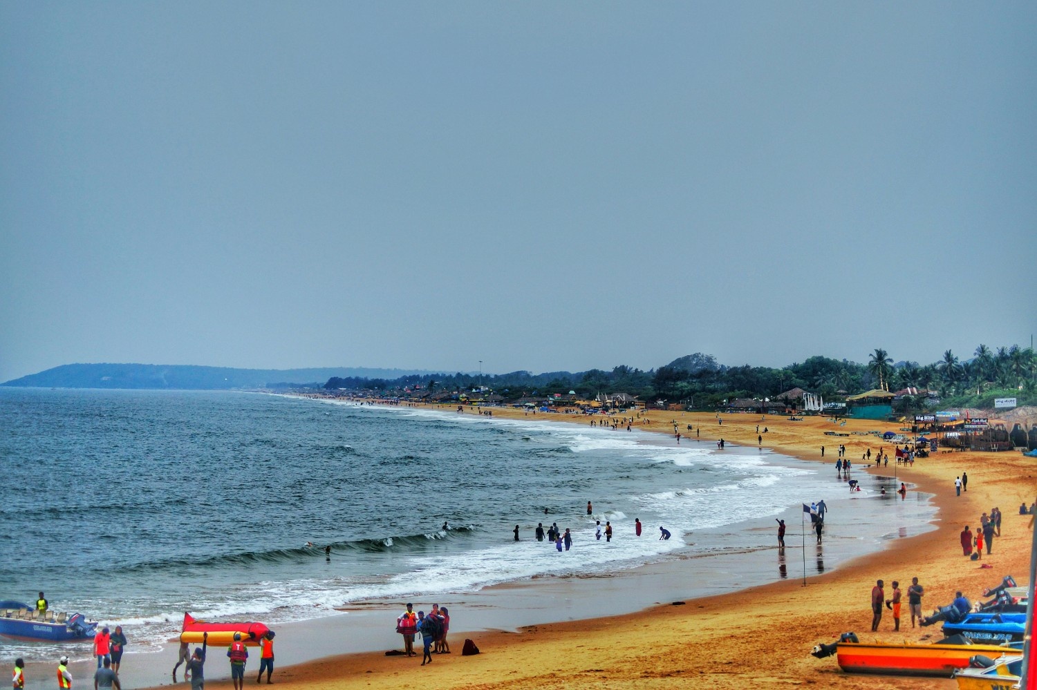 Goa tour package beach view with golden sand and clear water